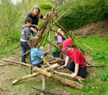 Children building with branches